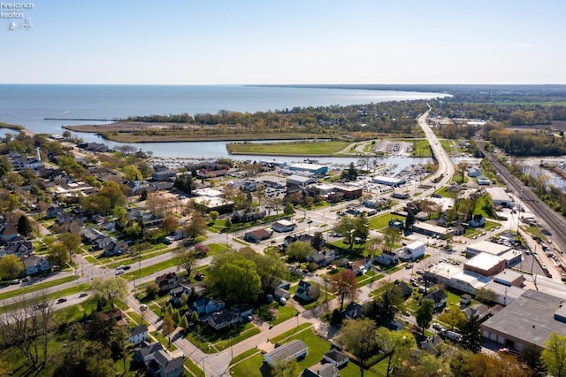 drone / aerial view featuring a water view and a residential view