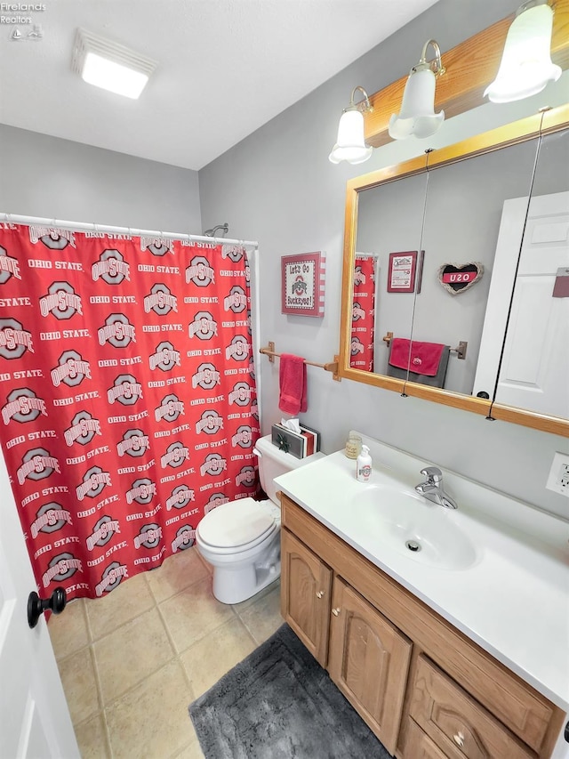 173 Excalibur Dr, Clyde, OH 43410 - bathroom featuring vanity, toilet, tile patterned floors, and a shower with shower curtain