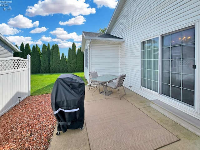 173 Excalibur Dr, Clyde, OH 43410 - view of patio featuring outdoor dining space, fence, and grilling area
