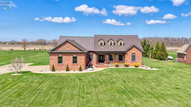 9117 W Mason Rd, Castalia, OH 44824 - view of front of property featuring a porch, a front lawn, and brick siding