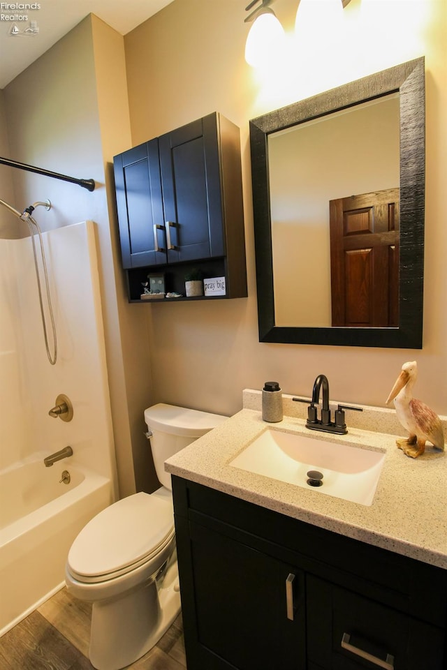 9117 W Mason Rd, Castalia, OH 44824 - bathroom featuring wood finished floors, toilet, vanity, and shower / tub combination