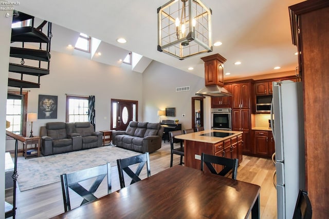 9117 W Mason Rd, Castalia, OH 44824 - dining space featuring light wood-style floors, recessed lighting, and high vaulted ceiling