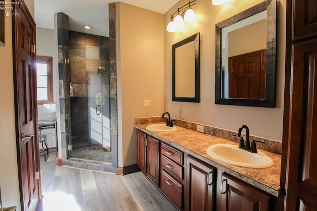 9117 W Mason Rd, Castalia, OH 44824 - full bathroom featuring wood finished floors, a shower stall, and double vanity