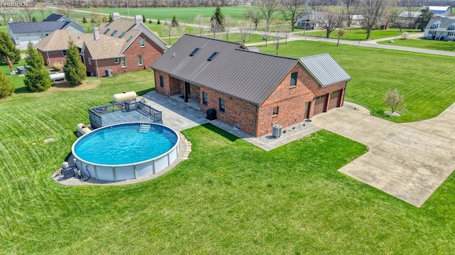 9117 W Mason Rd, Castalia, OH 44824 - swimming pool featuring a lawn and central AC
