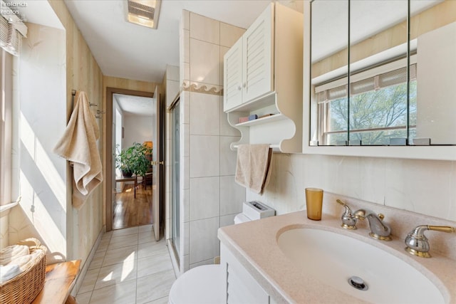 11595 Gore Orphanage Rd, Wakeman, OH 44889 - full bath with vanity, toilet, an enclosed shower, and tile patterned floors