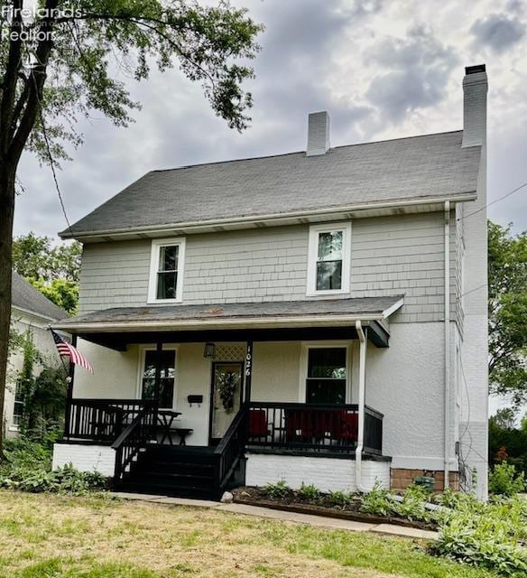 1026 Claremont Ave, Ashland, OH 44805 - view of front of home with covered porch and a front yard