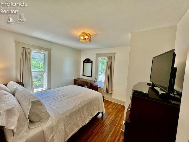 1026 Claremont Ave, Ashland, OH 44805 - bedroom featuring multiple windows and dark wood-style flooring