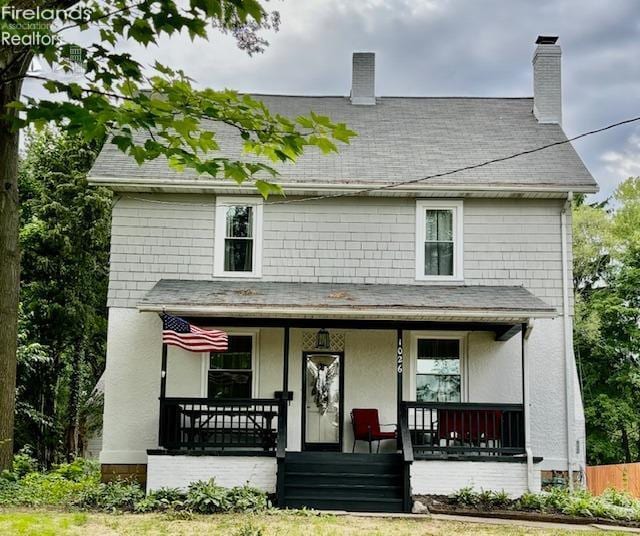 1026 Claremont Ave, Ashland, OH 44805 - view of front of house featuring covered porch, roof with shingles, and a chimney