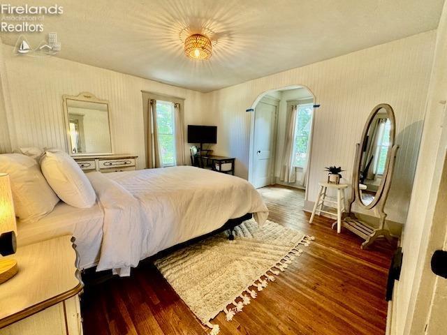 1026 Claremont Ave, Ashland, OH 44805 - bedroom with arched walkways and wood finished floors