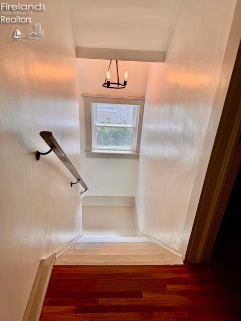 1026 Claremont Ave, Ashland, OH 44805 - stairway with wood finished floors and a chandelier