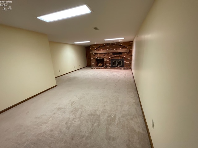 finished below grade area featuring baseboards and carpet flooring