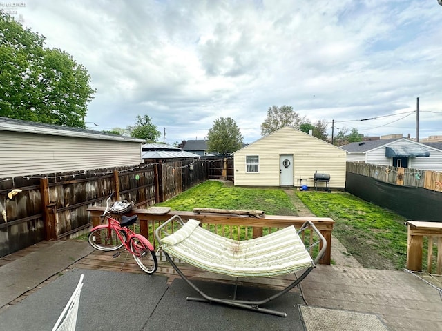view of patio / terrace featuring a fenced backyard, a deck, and a grill