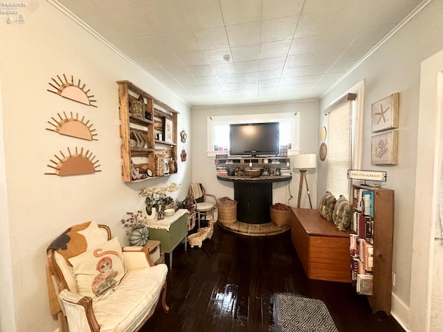 interior space featuring crown molding and hardwood / wood-style flooring