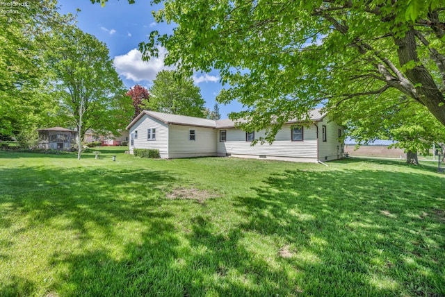 1733 County Road 302, Bellevue, OH 44811 - back of property featuring a lawn and crawl space