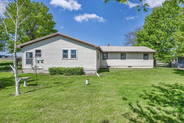 1733 County Road 302, Bellevue, OH 44811 - back of house featuring a lawn