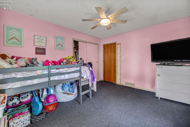 1733 County Road 302, Bellevue, OH 44811 - bedroom featuring dark carpet, a closet, and ceiling fan