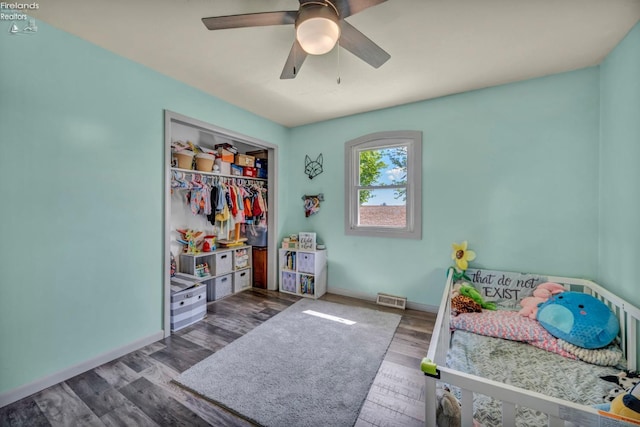 1733 County Road 302, Bellevue, OH 44811 - bedroom with baseboards, wood finished floors, ceiling fan, and a closet