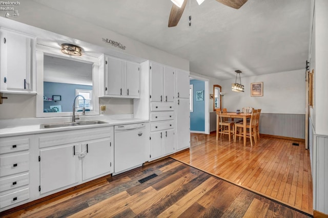 1733 County Road 302, Bellevue, OH 44811 - kitchen featuring white dishwasher, a sink, hardwood / wood-style flooring, white cabinets, and a ceiling fan