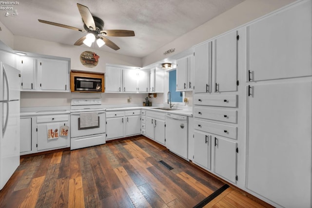1733 County Road 302, Bellevue, OH 44811 - kitchen featuring white appliances, a sink, a ceiling fan, light countertops, and white cabinetry