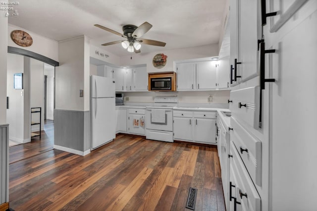 1733 County Road 302, Bellevue, OH 44811 - kitchen featuring white appliances, a ceiling fan, dark wood-style floors, light countertops, and white cabinetry