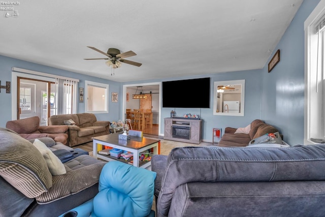 1733 County Road 302, Bellevue, OH 44811 - living area featuring a ceiling fan and plenty of natural light