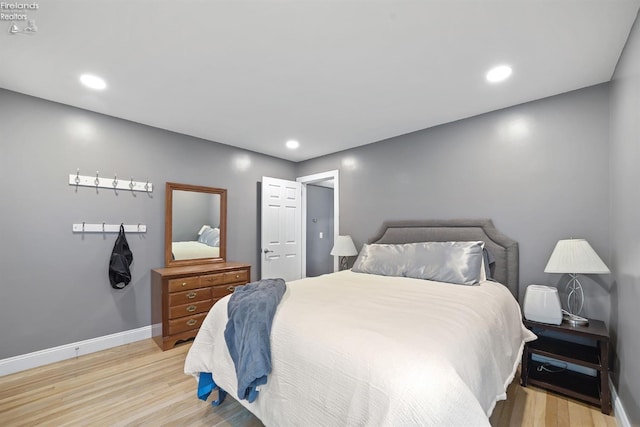 bedroom featuring recessed lighting, baseboards, and light wood finished floors