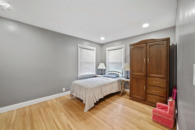 bedroom featuring recessed lighting, baseboards, and light wood finished floors