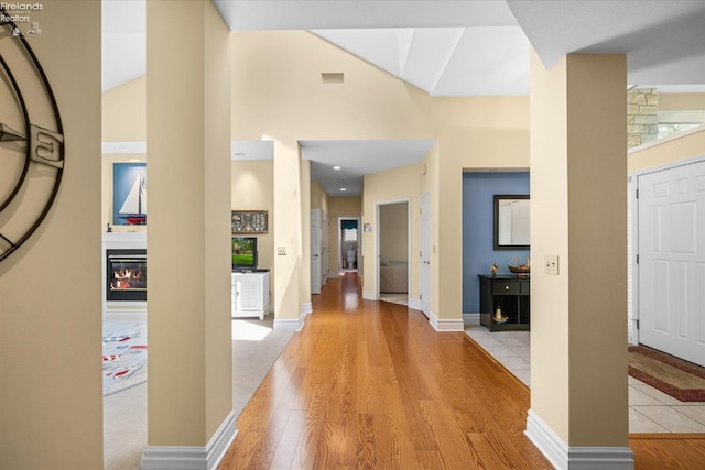 3535 E High Point Ln, Port Clinton, OH 43452 - hall featuring lofted ceiling, light wood-style flooring, and baseboards