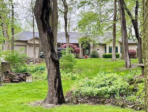 view of yard featuring an attached garage