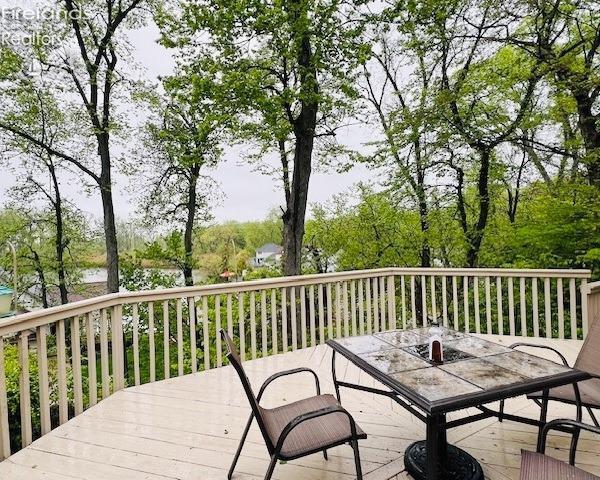 wooden deck with outdoor dining space