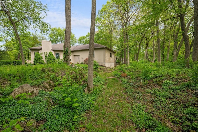 3535 E High Point Ln, Port Clinton, OH 43452 - view of side of home with stucco siding and a garage