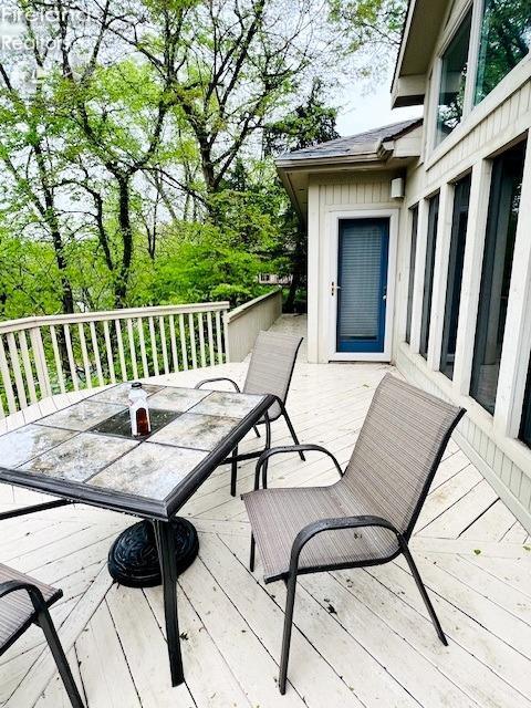 wooden terrace featuring outdoor dining area