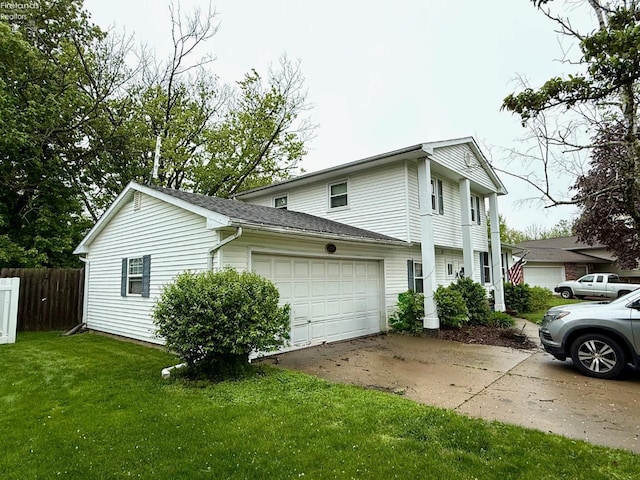 view of side of home featuring a garage, a yard, concrete driveway, and fence