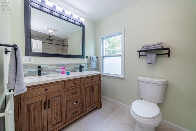 5033 Crestline Rd, Bucyrus, OH 44820 - bathroom featuring backsplash, baseboards, double vanity, and a sink