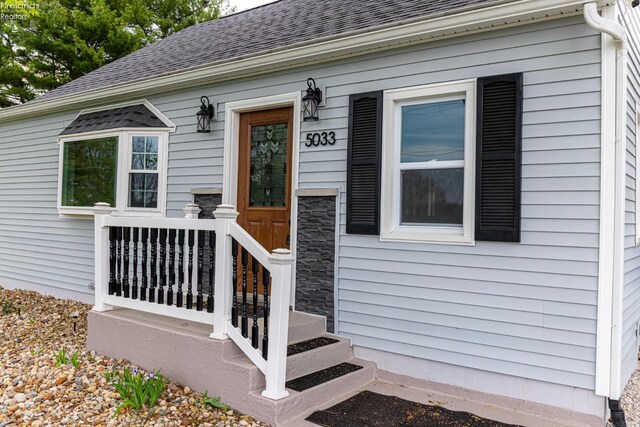 5033 Crestline Rd, Bucyrus, OH 44820 - doorway to property featuring roof with shingles