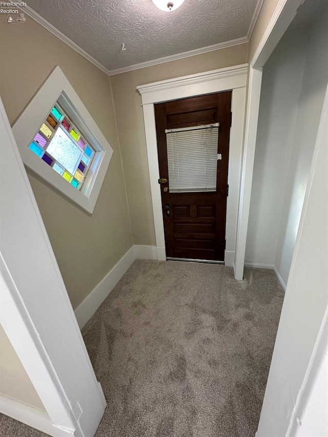 141 Main St, Castalia, OH 44824 - doorway to outside featuring ornamental molding, a textured ceiling, carpet flooring, and baseboards