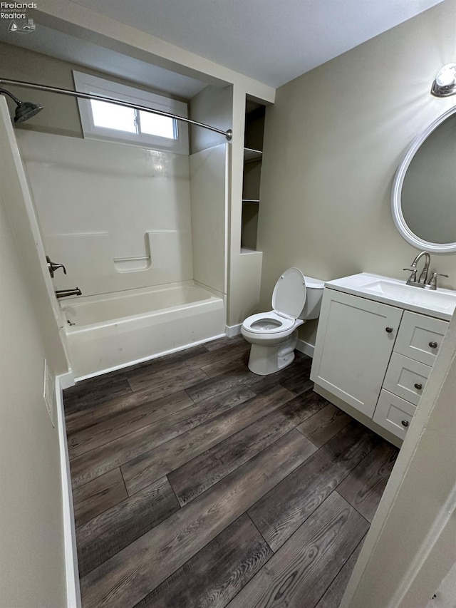 141 Main St, Castalia, OH 44824 - full bath with toilet,  shower combination, vanity, and wood finished floors