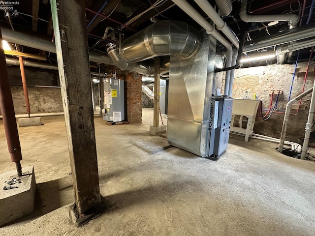 141 Main St, Castalia, OH 44824 - unfinished basement featuring water heater and heating unit