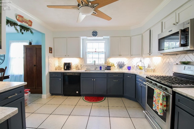 20 Chippewa Dr, Milan, OH 44846 - kitchen with white cabinets, backsplash, appliances with stainless steel finishes, and a sink
