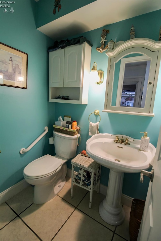 20 Chippewa Dr, Milan, OH 44846 - half bathroom featuring tile patterned flooring, toilet, and baseboards