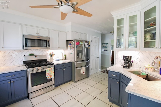 20 Chippewa Dr, Milan, OH 44846 - kitchen with a sink, blue cabinets, stainless steel appliances, and white cabinetry