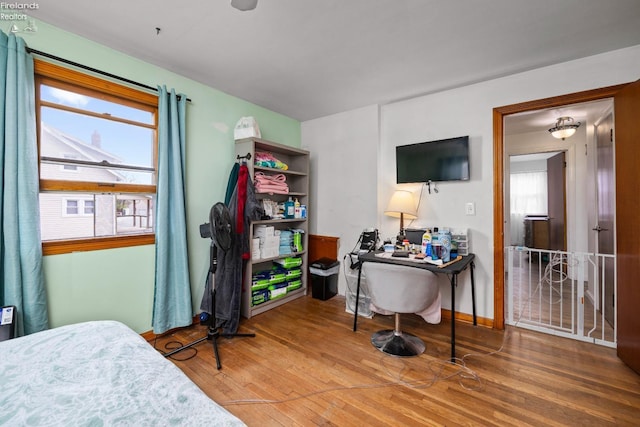 bedroom with wood finished floors