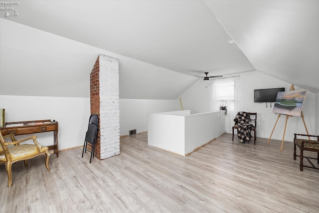bonus room featuring vaulted ceiling, wood finished floors, visible vents, and ceiling fan