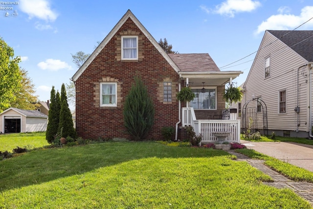 view of front of house with a porch, brick siding, and a front lawn