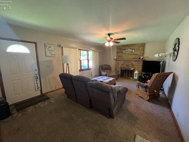 6 Breezewood Dr, Norwalk, OH 44857 - carpeted living area featuring a ceiling fan, baseboards, and a fireplace