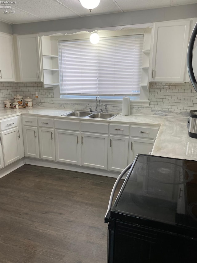 604 E Jefferson St, Sandusky, OH 44870 - kitchen featuring open shelves, black electric range, a sink, and white cabinetry