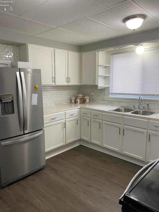 604 E Jefferson St, Sandusky, OH 44870 - kitchen with stainless steel refrigerator with ice dispenser, a sink, white cabinets, black range with electric stovetop, and dark wood-style flooring