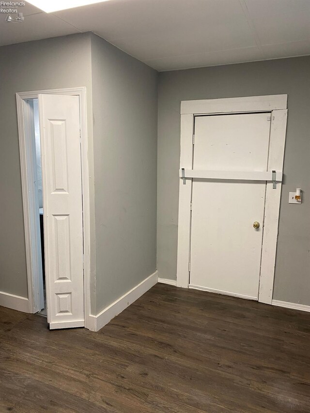 604 E Jefferson St, Sandusky, OH 44870 - spare room with baseboards and dark wood finished floors