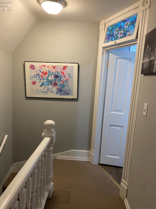 604 E Jefferson St, Sandusky, OH 44870 - hall featuring an upstairs landing, vaulted ceiling, carpet floors, and baseboards