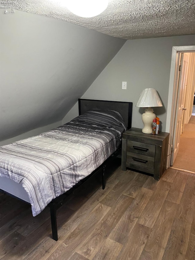 604 E Jefferson St, Sandusky, OH 44870 - bedroom with wood finished floors and vaulted ceiling